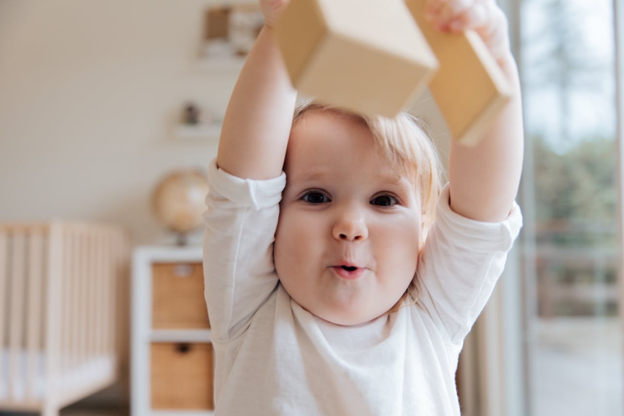 Baby playing with sensory toys in Manchester home